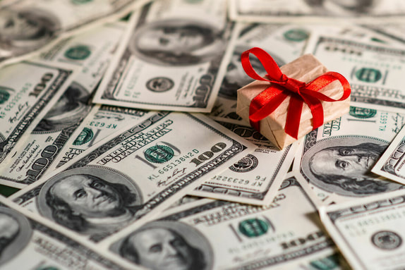 gift box on top of money